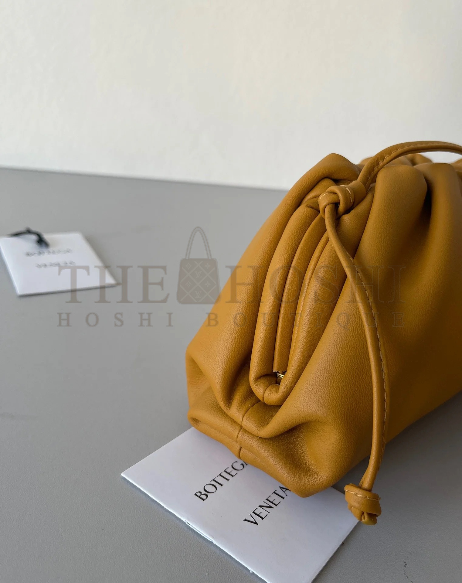 B0tt*ga Ven*ta Mini Pouch with Strap in Teak Calfskin Master Quality